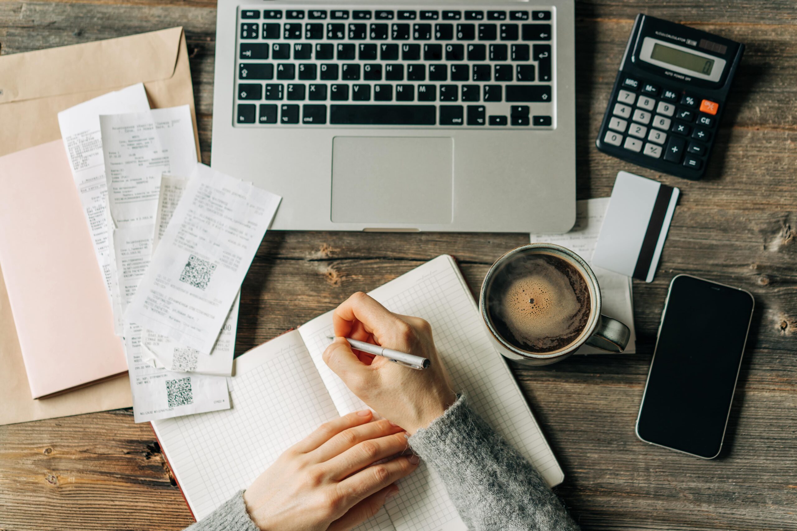top-view-of-the-workplace-of-an-accountant-writing-2023-11-27-04-52-55-utc-min